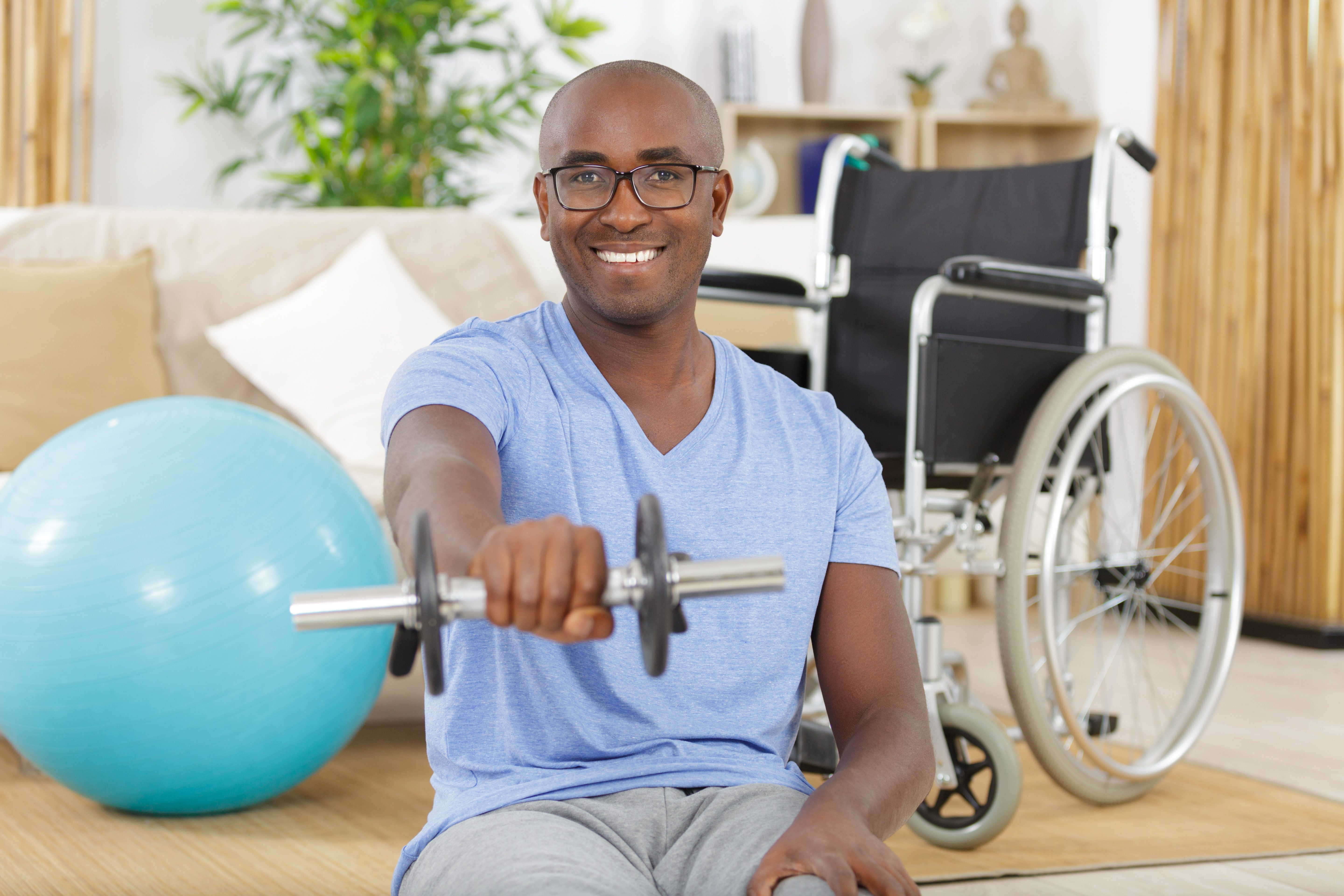 handsome disabled paraplegic man in wheelchair doing rehabilitation sport